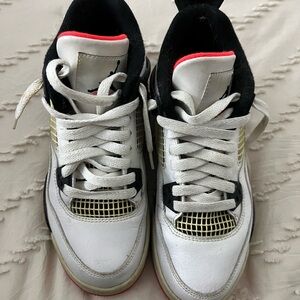 White and Black Sneakers with Red Accents